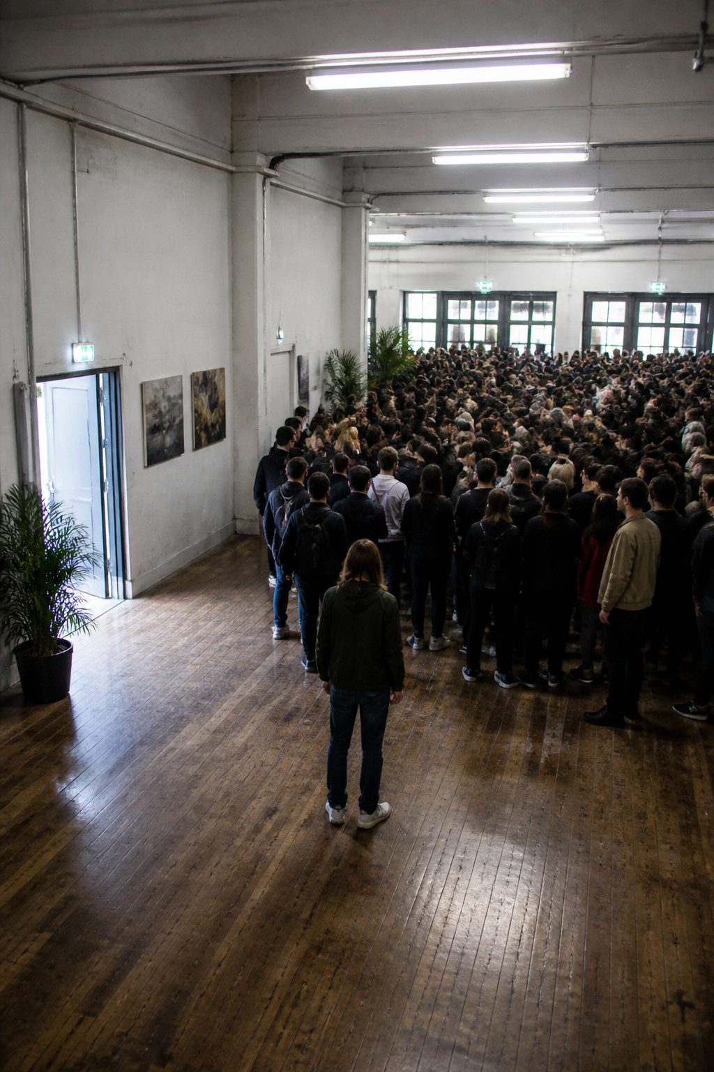 How to Survive a Stampede: 8 Steps for Escaping a Deadly Crowd (2026) 1 A photograph showing a crowded space with various exits visible.