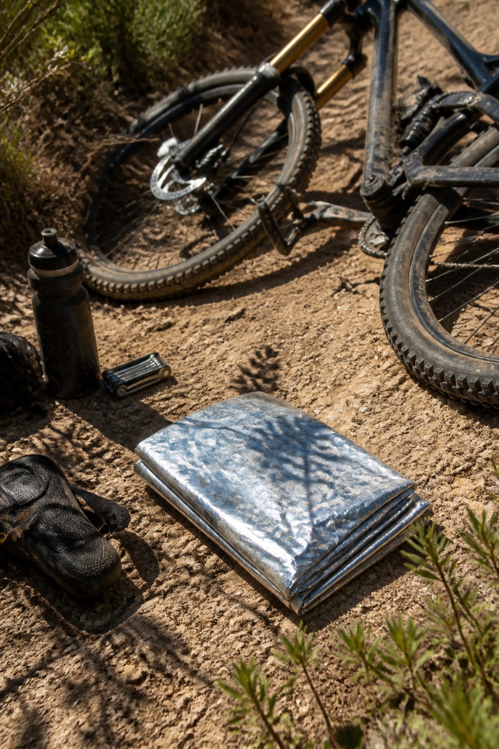 Mylar Blanket Uses: 38 Practical Ideas for Emergencies & Daily Life (2026) 31 A mylar blanket positioned next to a mountain bike for padding.