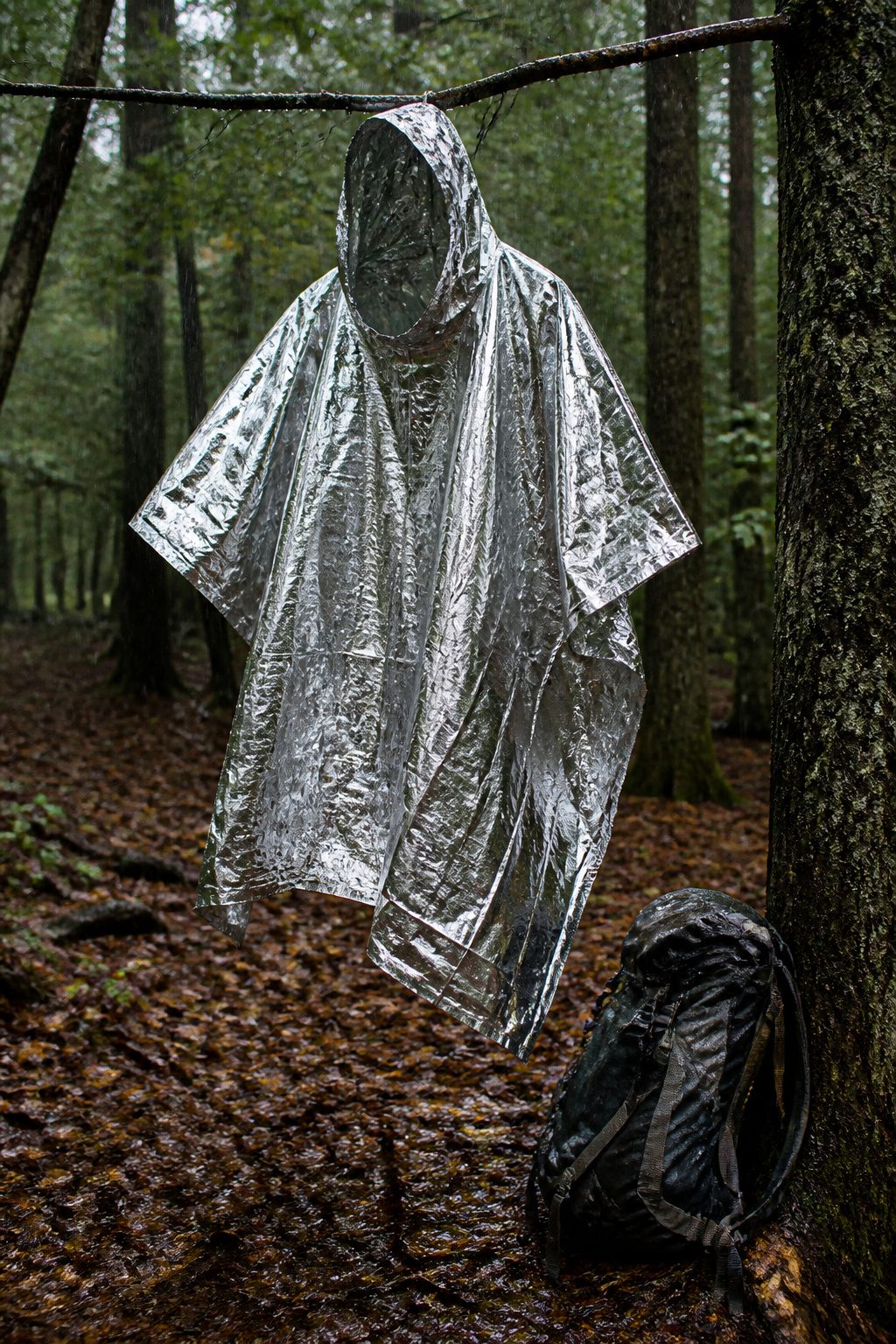 Mylar Blanket Uses: 38 Practical Ideas for Emergencies & Daily Life (2026) 7 A mylar blanket with a head hole cut for use as a rain poncho.
