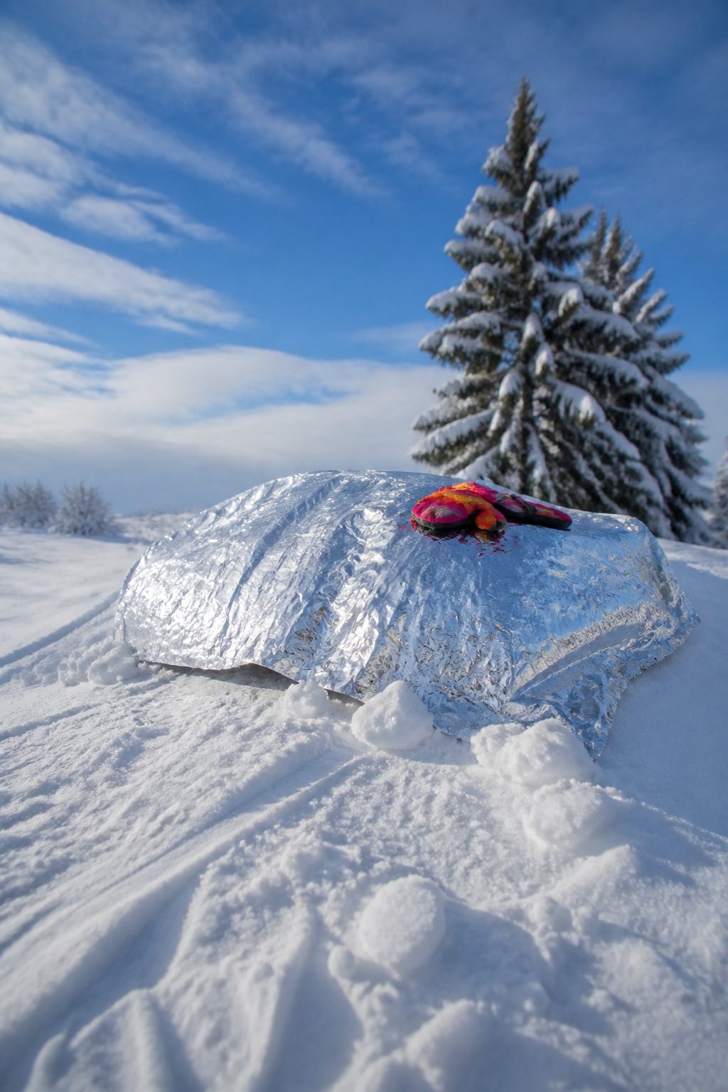 Mylar Blanket Uses: 38 Practical Ideas for Emergencies & Daily Life (2026) 38 A mylar blanket used as a sled on hardpack snow.