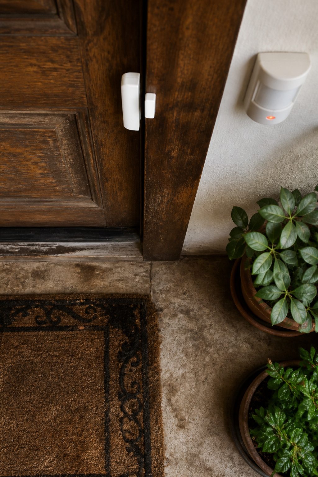 Door and window sensors are shown as part of a security system.
