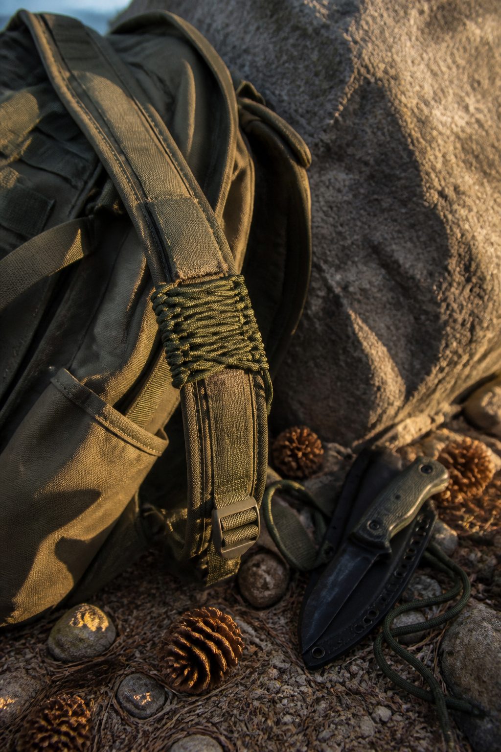 Paracord wrapped around tools and gear on a workbench.